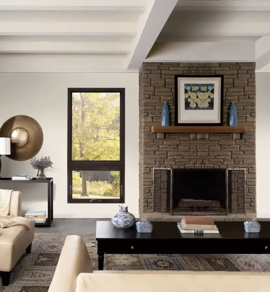A Gentek window featured in this cozy living room setting complete with fireplace